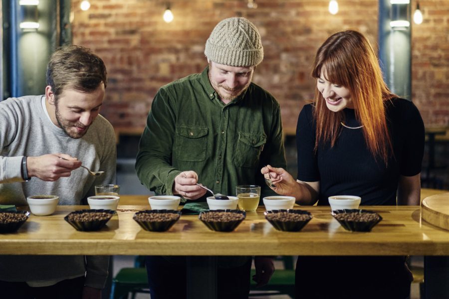 A group of friends at a coffee tasting event.